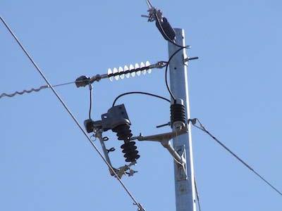Steel utility pole with blue sky background